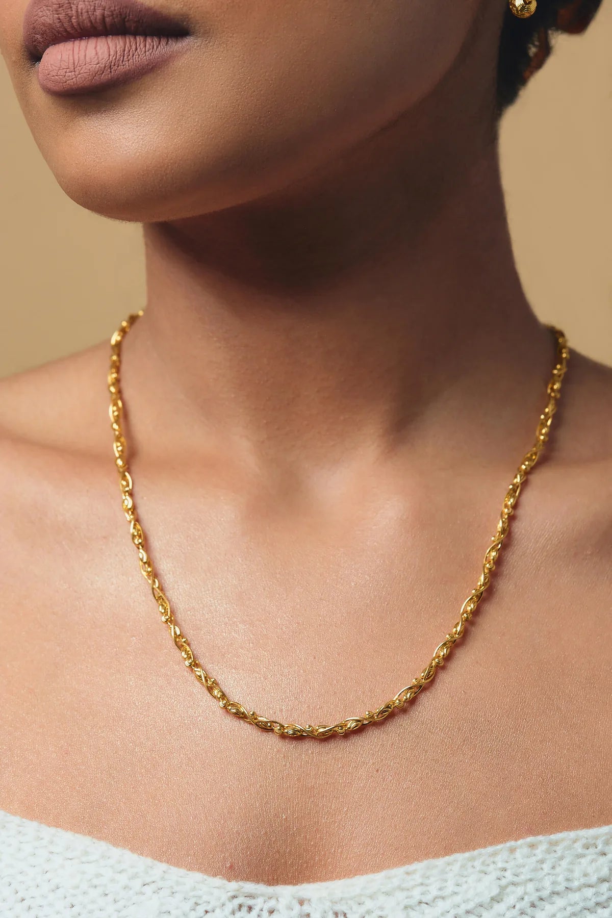 A 22K gold chain worn by an Omar Jewelers client