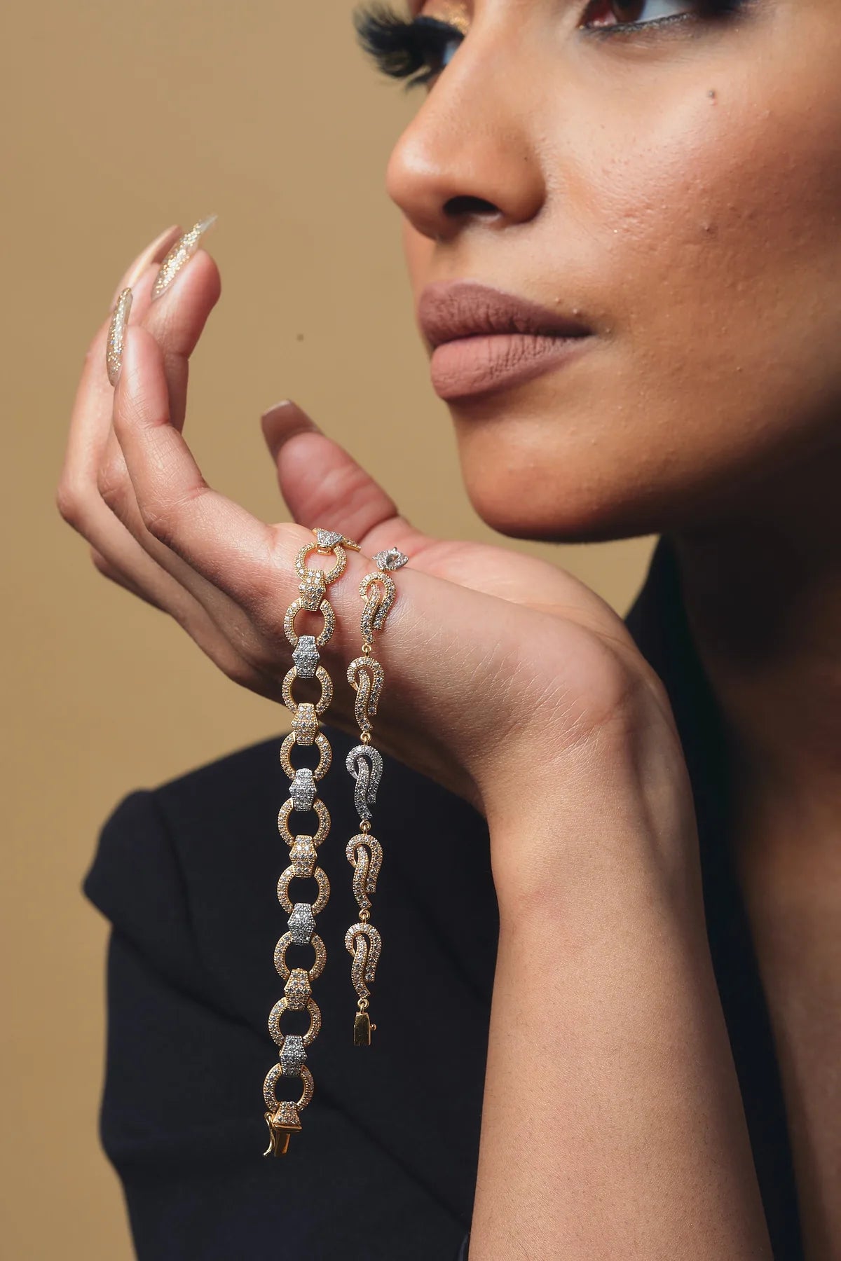 A diamond-set gold bracelet and earrings by Omar Jewelers